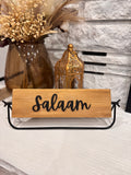 Salaam rotating wood sign