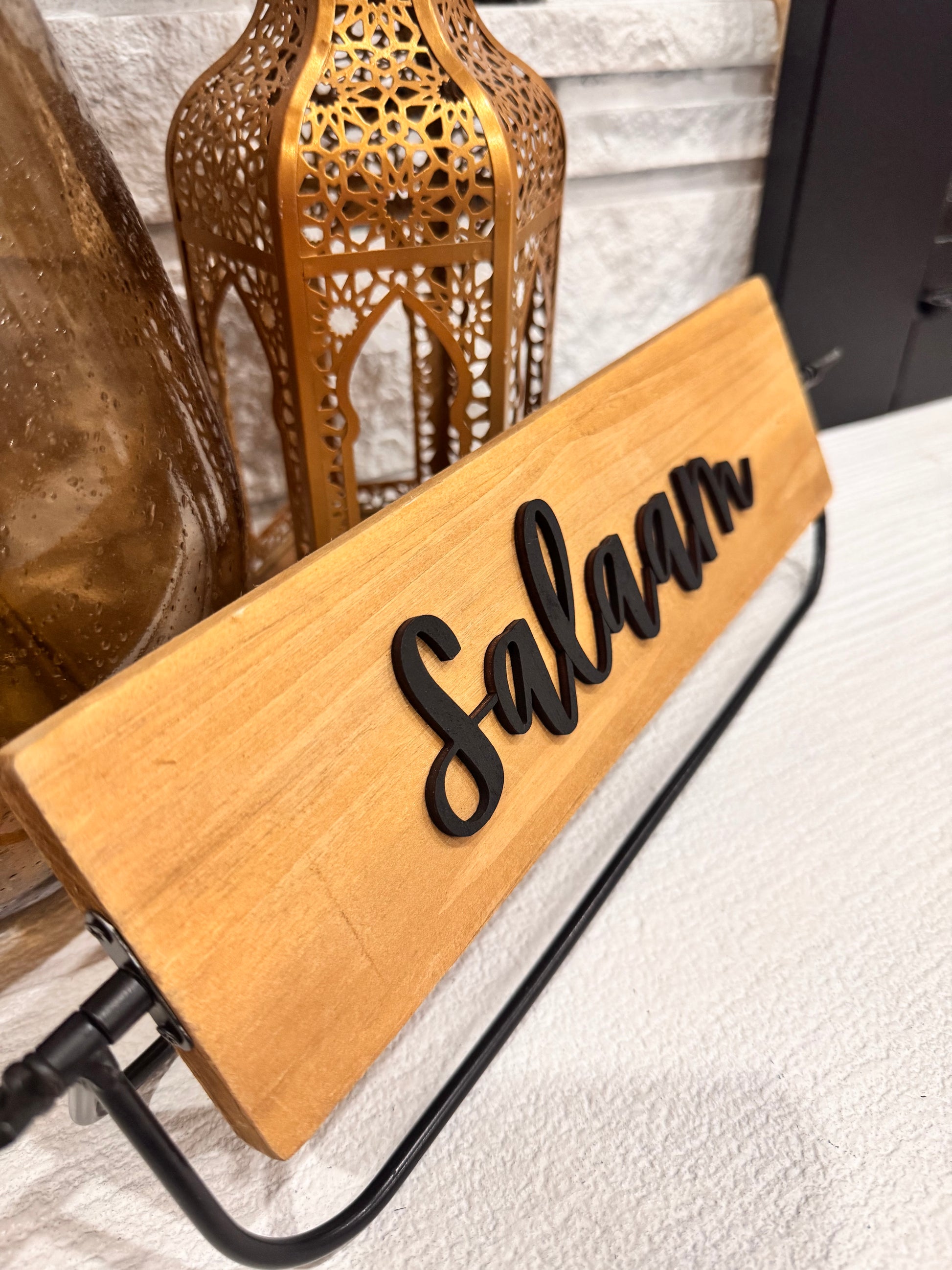 Salaam rotating wood sign